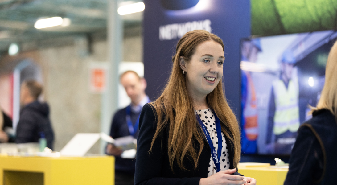 A woman in conversation at an event