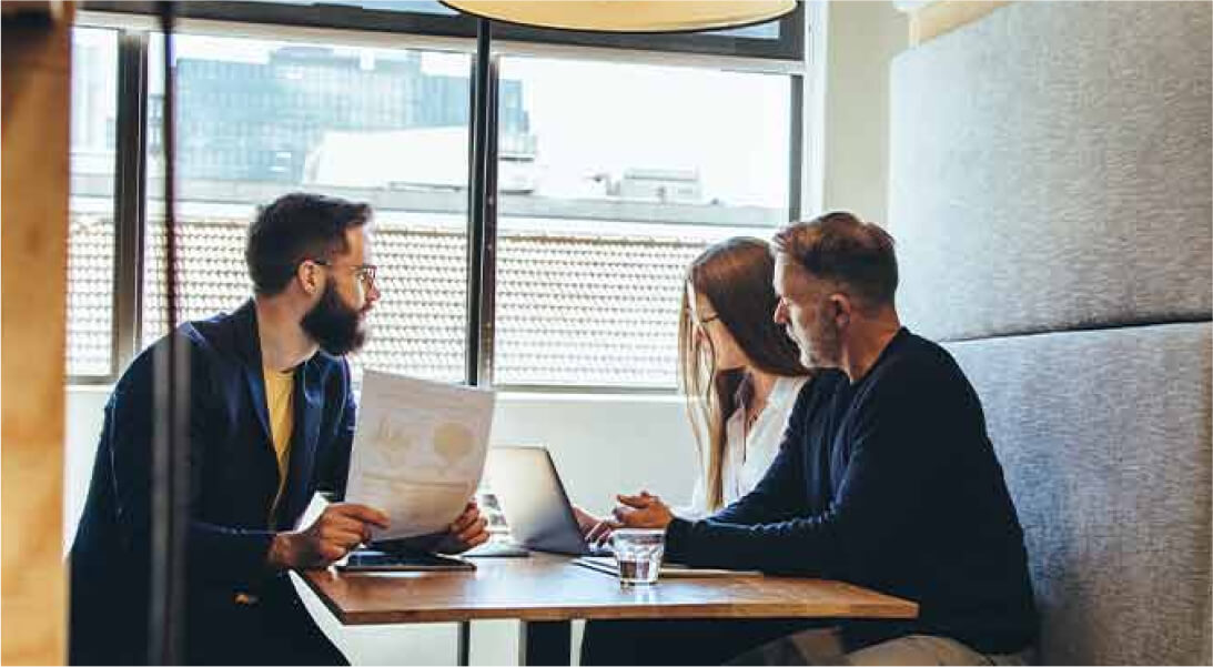 Business colleagues working around a table