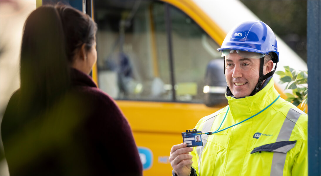 Technician showing his ID card to a customer