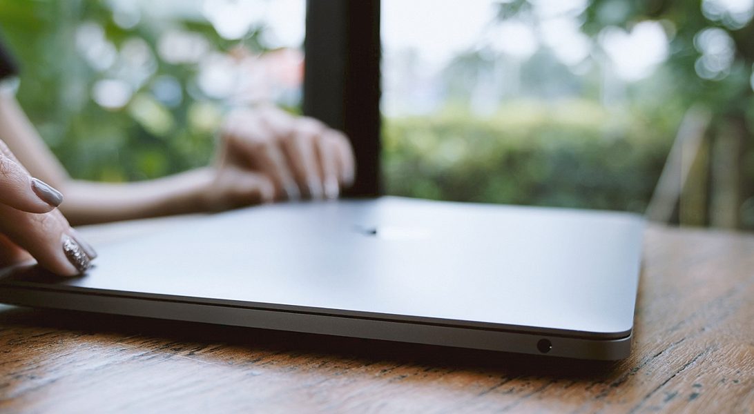 Lady opening a laptop