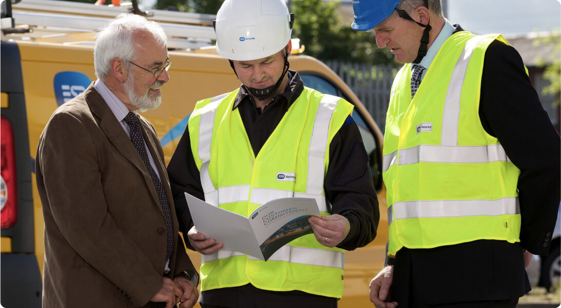 ESB Networks staff looking at a brochure
