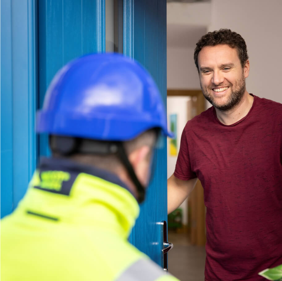 Customer at home welcoming ESB Networks technician