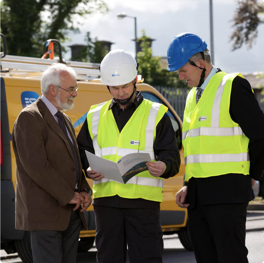 ESB Networks staff looking at a brochure
