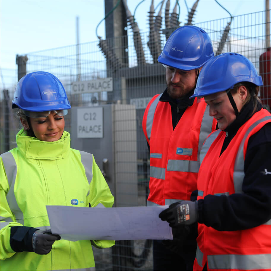 technicians looking at a map