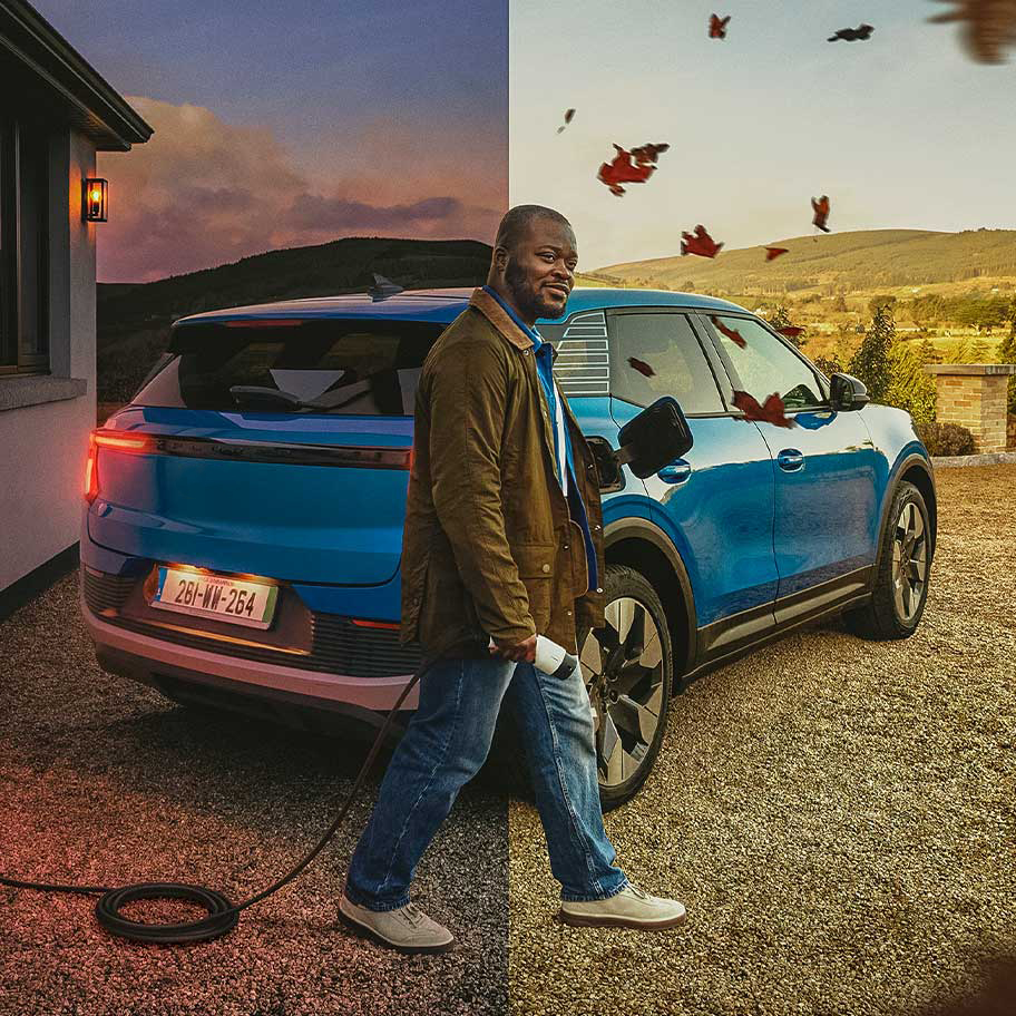 A man charging his EV at home